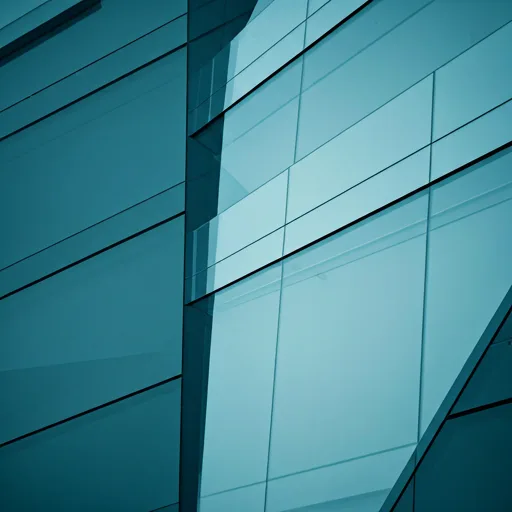 Abstract architectural shot of a modern office building glass facade with sharp angles